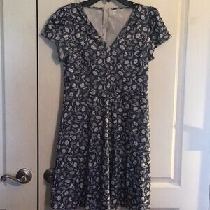 New never worn, stretchy material, dress size small, and branded